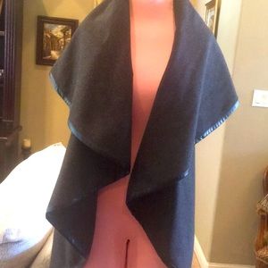 Beautiful Gray poncho wool with leather trim.